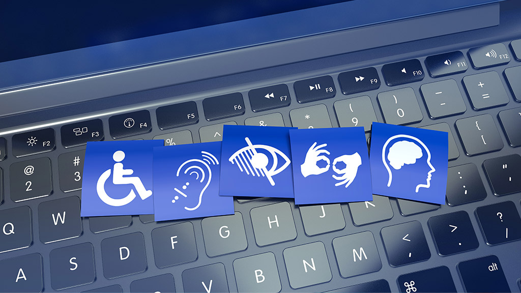 Accessibility icons for wheelchair access, hearing, low vision, sign language and cognitive support laid over a laptop keyboard.